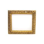 19th century Continental carved gilt gesso frame with pierced scroll cushion ornament,