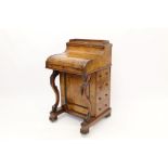 Mid-Victorian figured walnut piano-top davenport with rising stationery compartment,