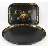 George III oval black papier mâché tray with painted gilt flowers and acorn decoration to border,