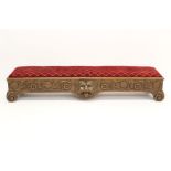 Unusual carved oak long stool with cushion upholstered hinged seat on relief carved frieze centred