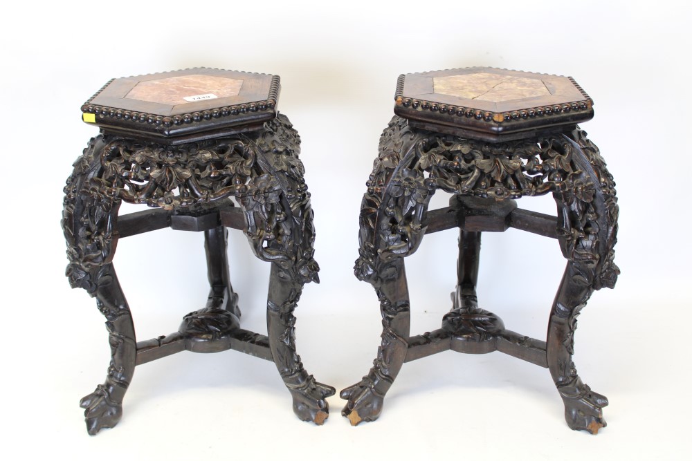 Pair of late 19th / early 20th century Chinese carved hardwood and marble inset urn stands,