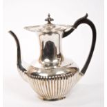 Edwardian silver coffee pot of half-fluted baluster form, with shell and foliate border,