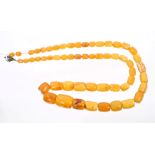 Amber bead necklace with graduated amber beads, length approximately 73cm.