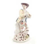 18th century Bow polychrome porcelain figure, circa 1760, of a piper with hound,