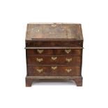 Early 18th century walnut crossbanded and feather-banded bureau with hinged fall enclosing a fitted