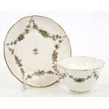 Bristol-style tea bowl and saucer with green painted floral swags - marked with blue 'B' and cross
