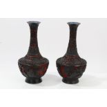 Pair Chinese black lacquer and cinnabar vases with pierced floral and landscape decoration,