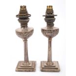 Pair late 19th / early 20th century Chinese silver miniature oil lamps with original oil reservoirs