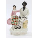 Victorian Staffordshire figure group of a Negro and child, entitled - 'Eva & Uncle Tom',