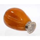 Late Victorian natural amber-handled seal with silver plated mount and NHS monogram,