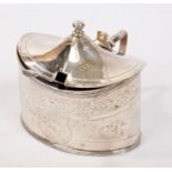George III silver mustard pot of oval form, with bright cut decoration,