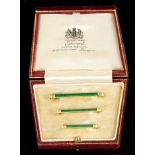 Set of three good quality gold and green enamel graduated tie pins in original fitted leather box