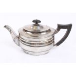 George V silver teapot of oval ribbed form,
