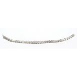 Diamond tennis bracelet with a line of thirty-four brilliant cut diamonds in grain setting with