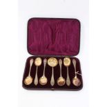 19th century Belgian silver gilt dessert set - comprising six spoons with raised floral decoration