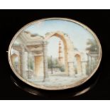 Antique Indian oval miniature painting on ivory depicting a temple ruin,
