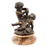 After Clodion: Antique bronze figural group of two cavorting putti, raised on figured marble socle,