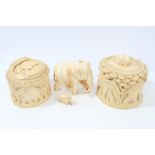 Two late 19th / early 20th century ivory containers with carved elephant decoration and matching