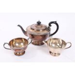 Contemporary silver three piece tea set - comprising teapot of cauldron form,