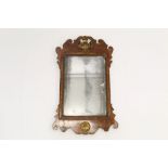 George II-style walnut fret carved wall mirror,