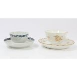 18th century Lowestoft blue and white tea bowl and saucer with moulded floral decoration and blue