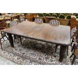 Victorian carved oak extending dining table, the rounded rectangular top with acanthus carved edge,