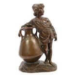 Late 19th / early 20th century bronze depicting a peasant boy, beside a large urn,