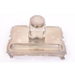 1920s silver ink stand of shaped rectangular form, with raised border,