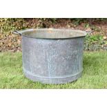 Very large copper vessel, straight-sided with everted rim and twin flanking handles,