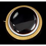 Mid-Victorian gold and banded agate circular target brooch with locket back,