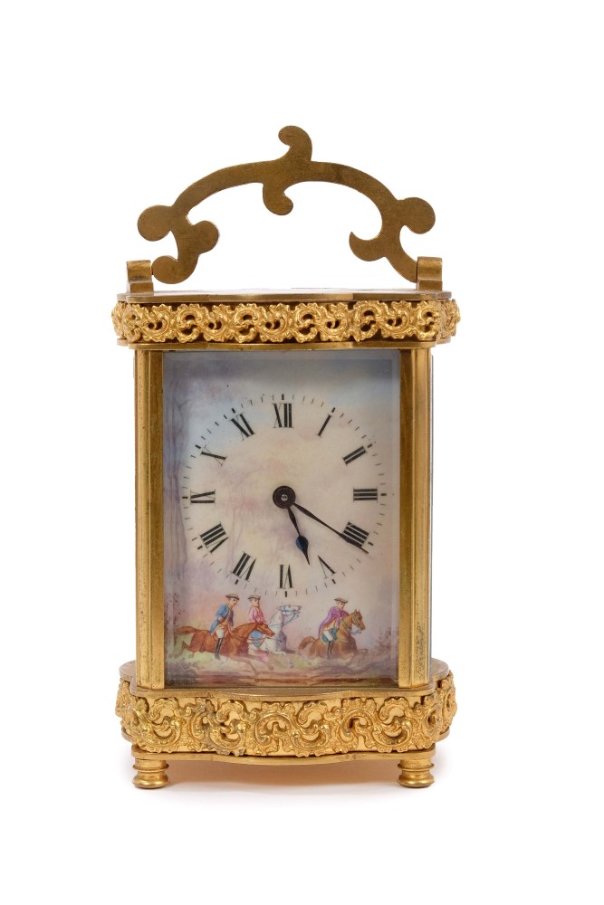 Good quality late 19th century gilt brass carriage clock with rococo scrollwork decoration -