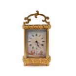 Good quality late 19th century gilt brass carriage clock with rococo scrollwork decoration -
