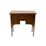 George III mahogany satinwood and patera inlaid dressing table with central short drawer and