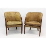 Pair of leather upholstered tub chairs with close-stud upholstery,