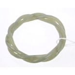 Jade bangle formed by two carved interwoven ropetwist bangles,