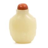Chinese Qing carved green jade snuff bottle with stained ivory stopper and carved ring side handles,
