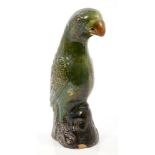19th century Chinese green glazed pottery parrot with moulded and incised feathers, on rococo base,