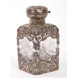 Edwardian cut glass scent flask encased in a scroll and floral rococo mount,