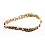 Yellow metal curb link bracelet,