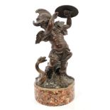 19th century Continental bronze ornamental match holder in the form of a winged armoured putto