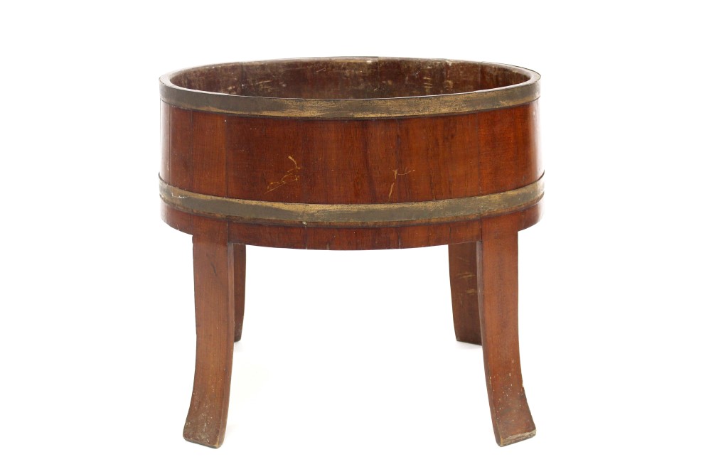 19th century mahogany and brass bound wine cooler of oval coopered form,