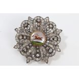 Victorian-style diamond brooch with a central Essex crystal cabochon intaglio depicting a jockey on