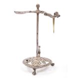 Late Victorian wax jack in the George III style, with central bar and pierced sprung taper holder,