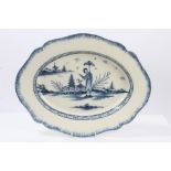 Late 18th century pearlware blue and white meat plate painted with Oriental figure in landscape