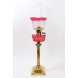 Early 20th century oil lamp with etched ruby glass shade and reservoir,