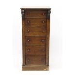 Victorian oak Wellington chest with seven drawers and lockable stile, on plinth base,