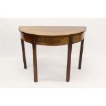 George III mahogany D-shaped table, raised on channel carved legs,