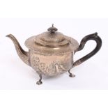 Late Victorian silver teapot of circular form, with flared scroll border,