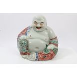 Early 20th century Chinese porcelain figure of Buddha in seated pose, with polychrome robe,