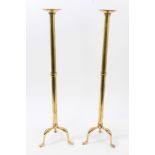 Pair brass pricket candlesticks with tripod bases and pad feet, 61.